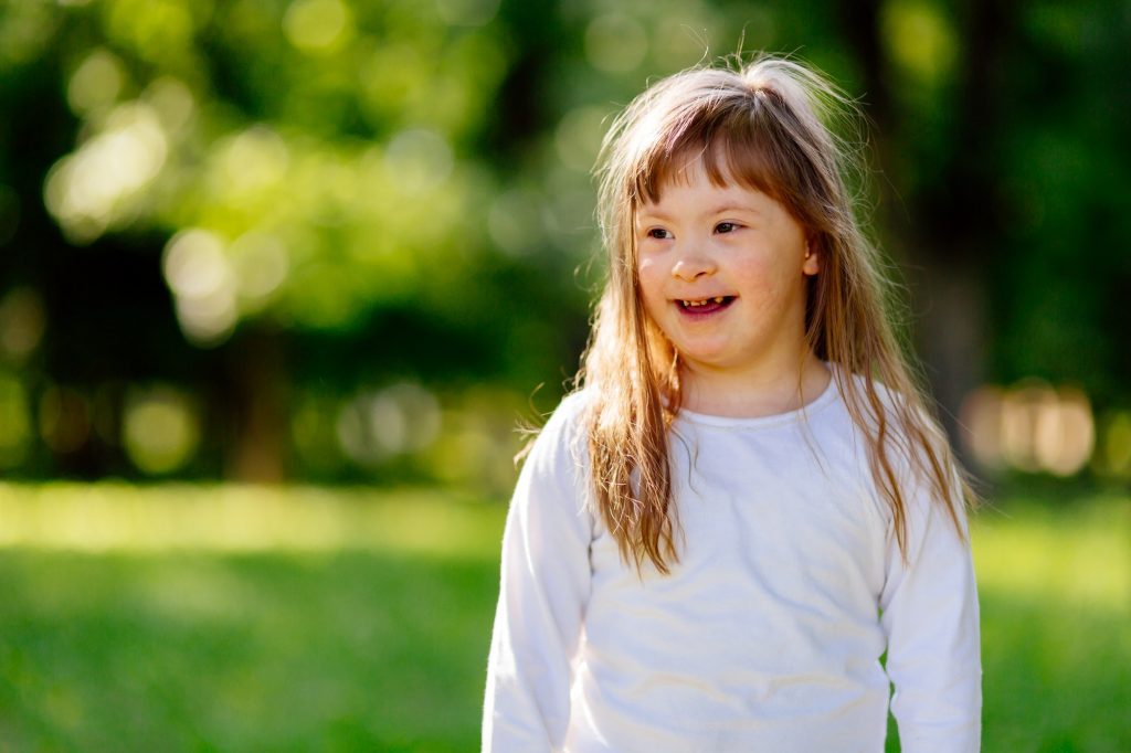 Beautiful happy child smiling outdoors
