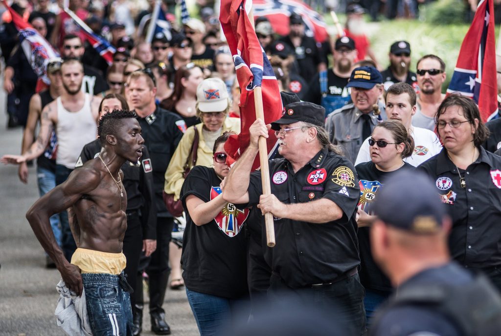 Black man confronting KKK Protesters
